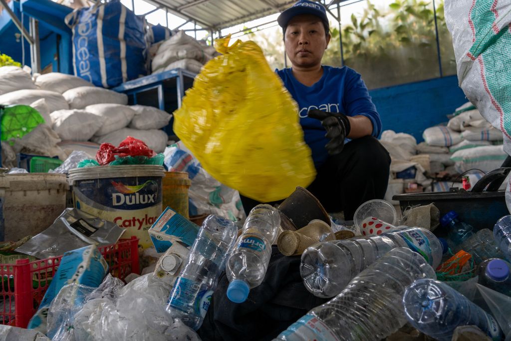4Ocean staff sorting the garbage collected on the beach.