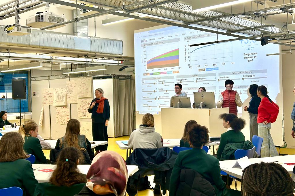 Dr Ro Spankie, Assistant Head of the School of Architecture and Cities and Convener of the ArCCAT, speaks to the students during a Mock COP event.