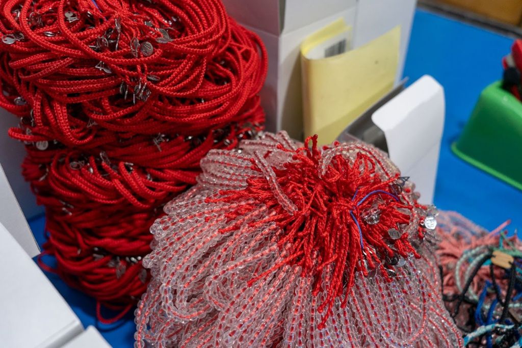 The plastic collected by 4Ocean is turned into bracelets for sale.