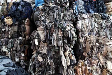 Thrown away clothes; fast fashion waste.